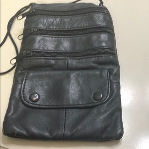 A wristlet black bag with shoulder string